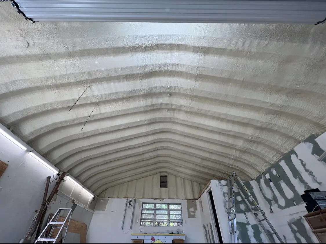 Spray polyurethane foam applied to the underside of a metal roof deck in Florida City